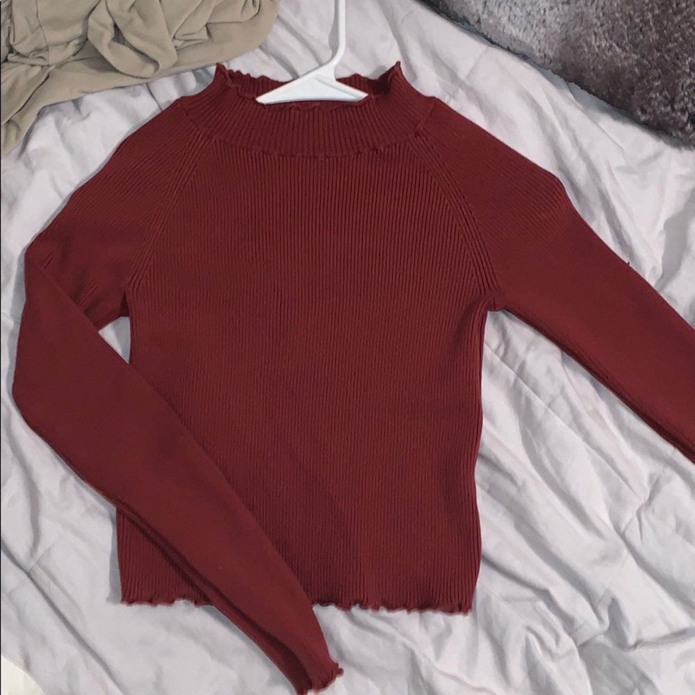Ruffled detailing turtle neck